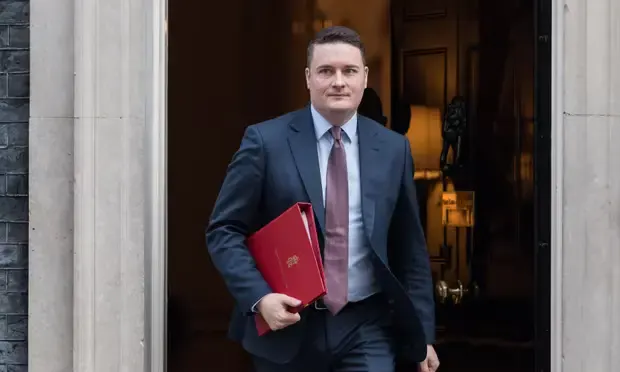 NHS England to halve workforce amid Streeting's restructuring.